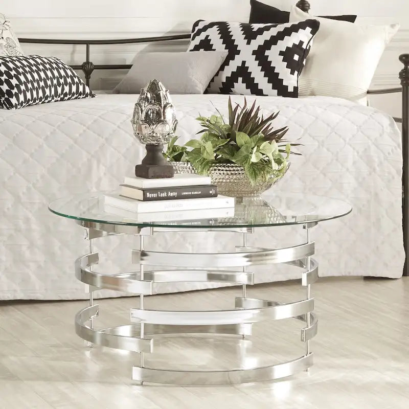 Table d'appoint à plateau en verre rond et piètement en fer motif tourbillon